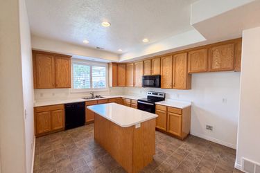 Photo 2 of 20 of 6943 W Bamburgh Way, West Valley City, UT