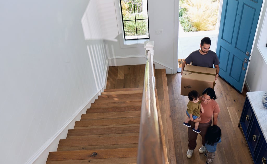 First-time buyers outside a home