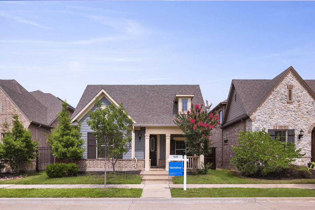 A home that's been sold to opendoor in the middle of two other homes