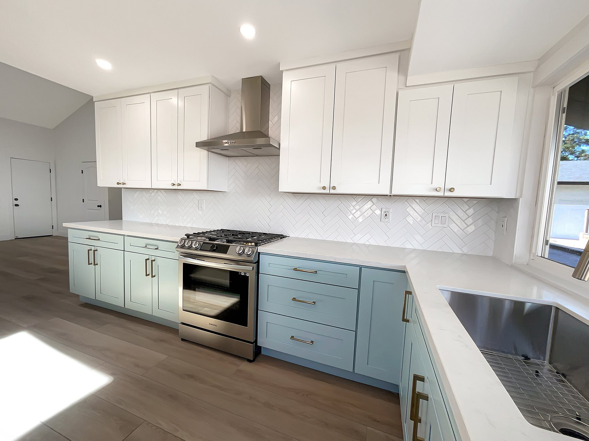 These light blue base cabinets in San Diego use Sherwin Williams' "SW 6218 Tradewind".