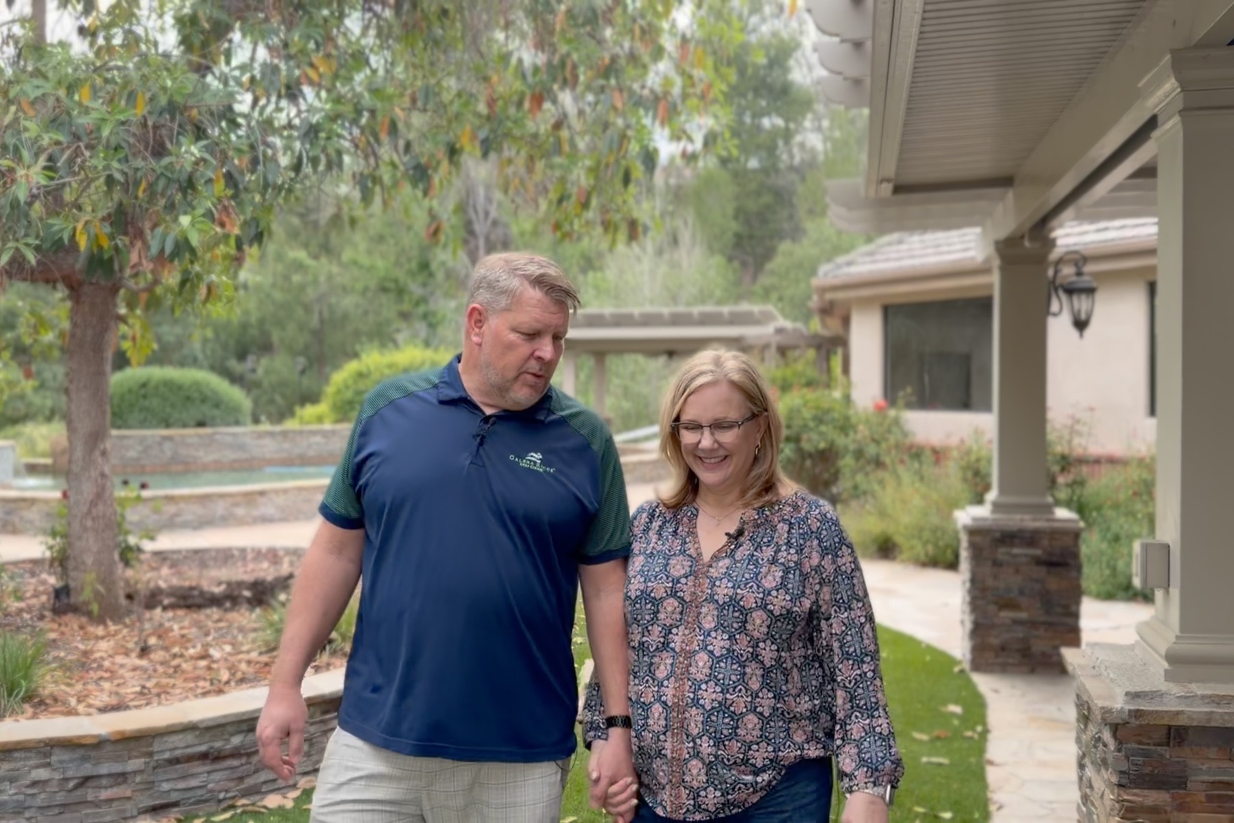 The Watsons walking hand in hand outside their Temecula, California home